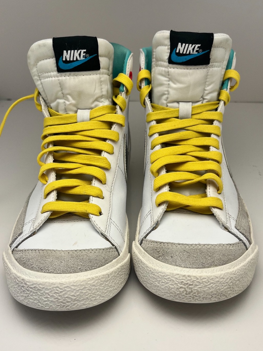 Nike Kids High-Top Sneakers in White with Yellow Laces and Teal Accents